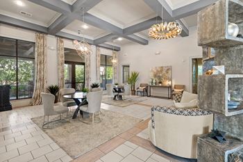 Interior of the Stonepost Crossing clubhouse with seating and dining areas and tasteful decor.